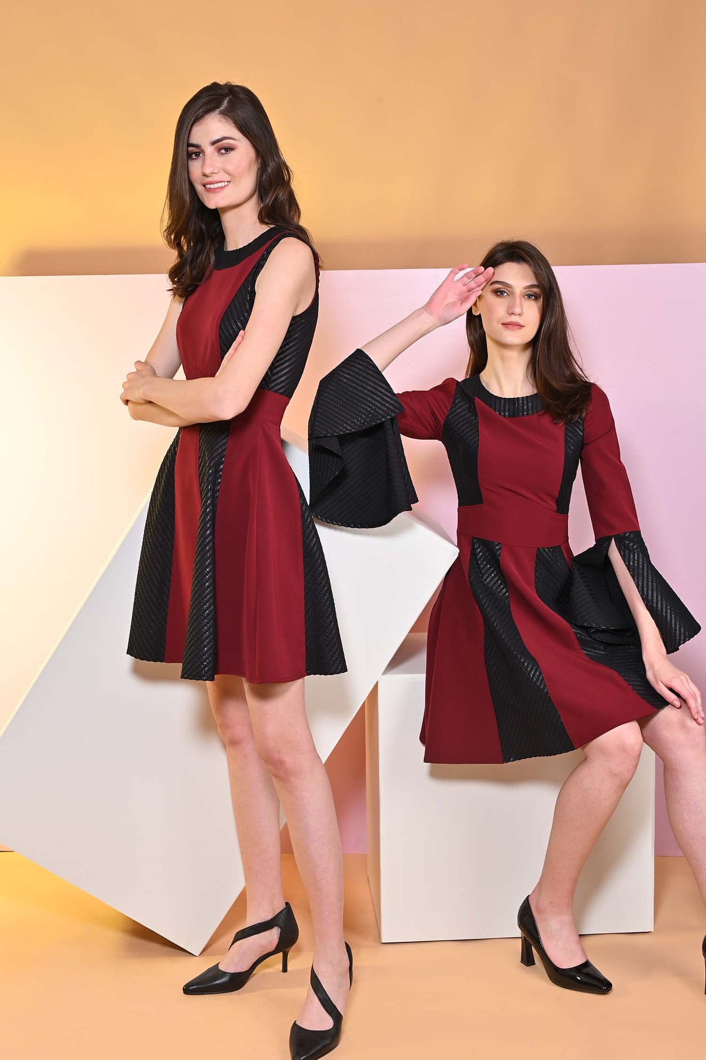 Sanguine Pitch flared dress with cape sleeves